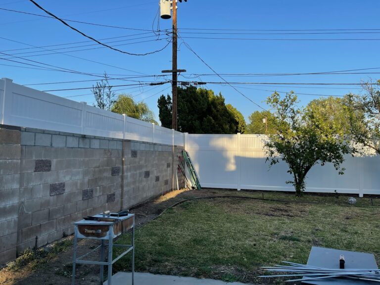 white vinyl fence