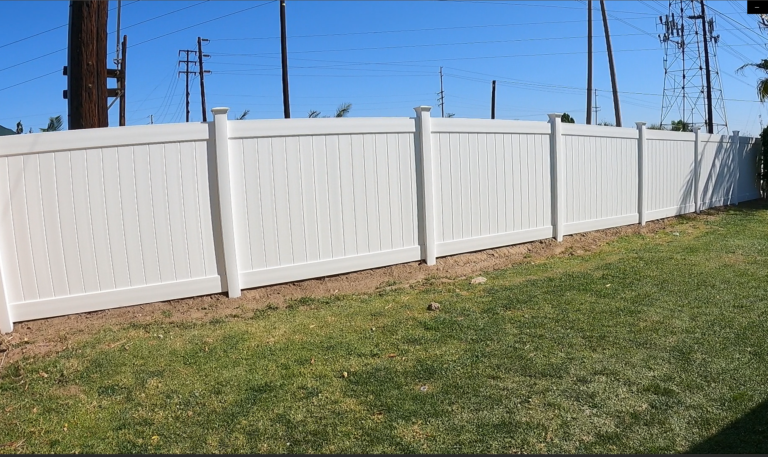 white vinyl fence